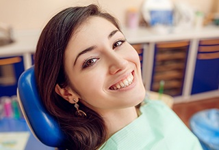 Smiling woman in dental chair