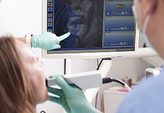 Dentist capturing digital impressions of teeth
