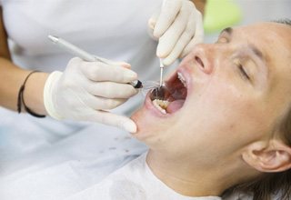 Patient receiving dental cleaning 