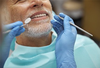 Up-close view of man having his teeth cleaned