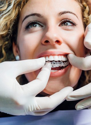 Invisalign can align your smile faster than braces near Mendota Heights
