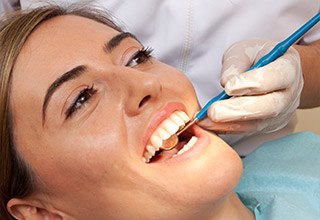 Woman receiving a preventive dentistry checkup in Inver Grove Heights