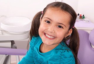 Smiling child in dental chair