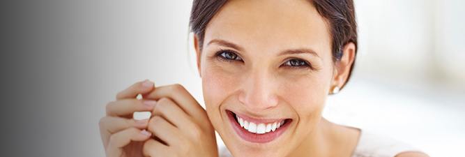 Smiling brunette woman with a ponytail
