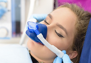 Dental patient with a nose mask on for nitrous oxide sedation dentistry